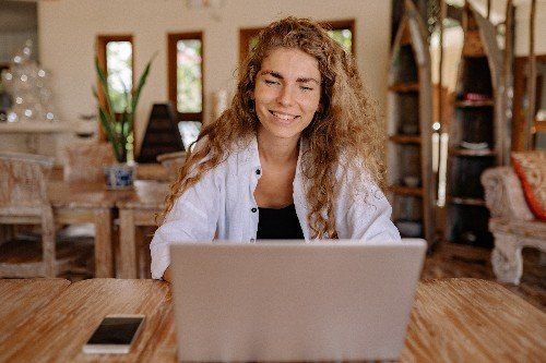 happy woman working at her computer